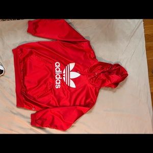 Red adidas hoodie. Material is like silk very comfortable
